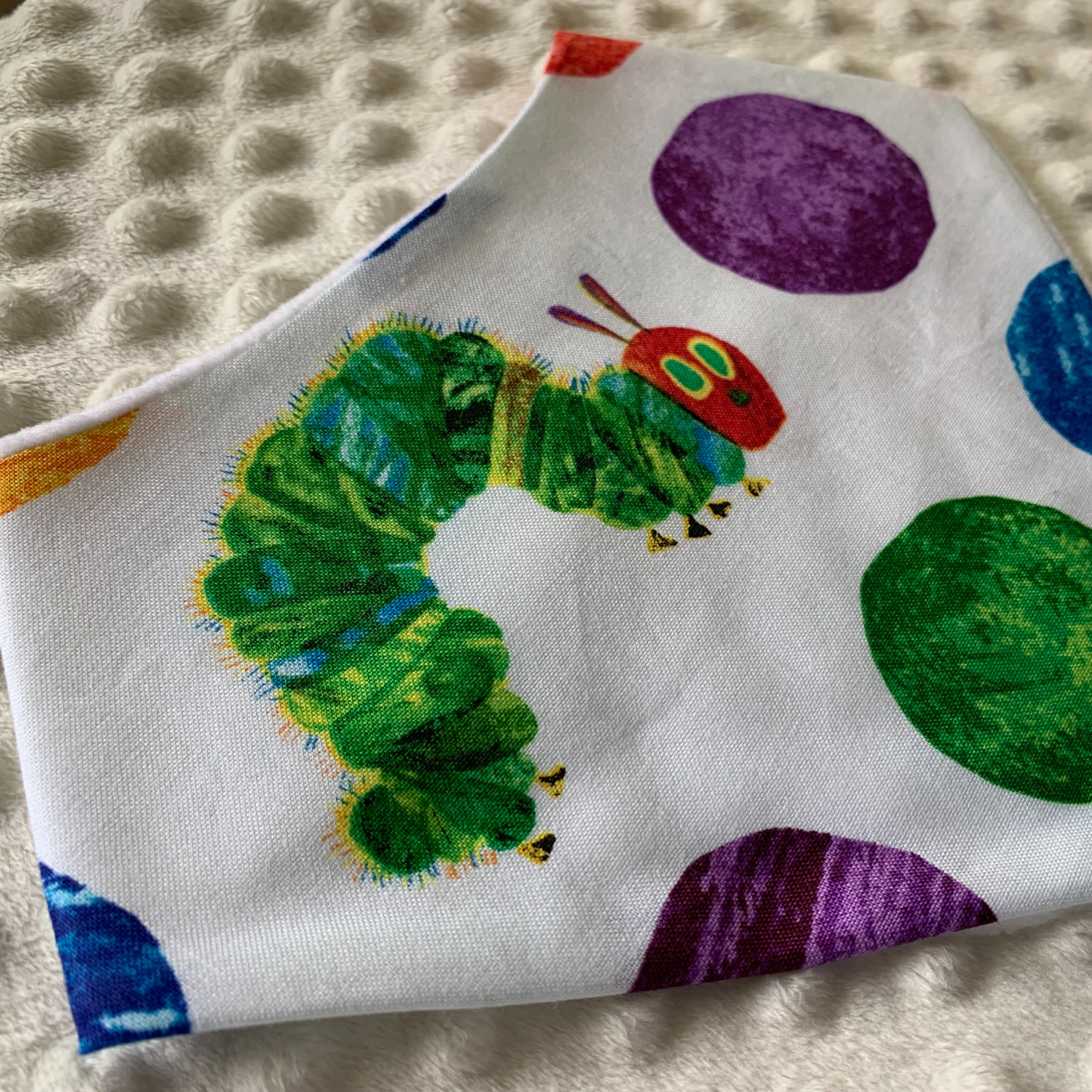 Inspired by one of our favorite bedtime stories, this whimsical bib is the perfect choice for your future readers. Gift this very hungry caterpillar bib to your favorite librarian or book lover.