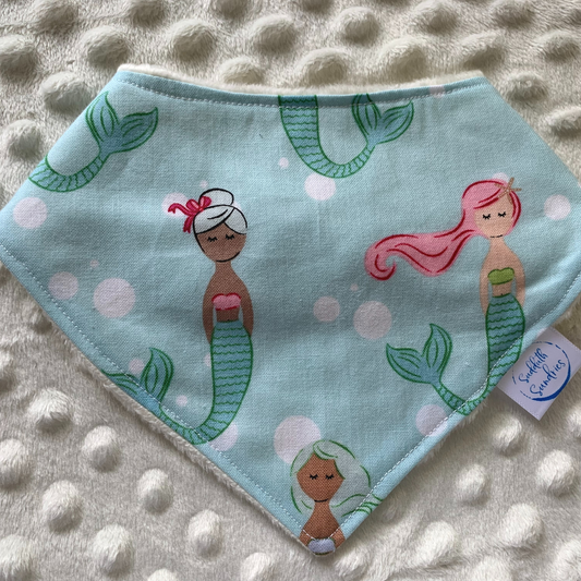 Are you having or attending a mermaid baby shower? Or an under the sea first birthday party?! I love the colorful mermaids featured on this bib!