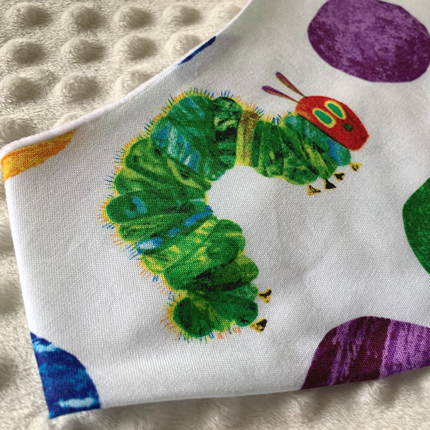 Inspired by one of our favorite bedtime stories, this whimsical bib is the perfect choice for your future readers. Gift this very hungry caterpillar bib to your favorite librarian or book lover.